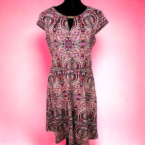 Purple patterned dress, white, pink, black and coral, zips down the back